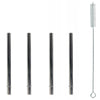 Set of four metal straws and a cleaning brush on a white background