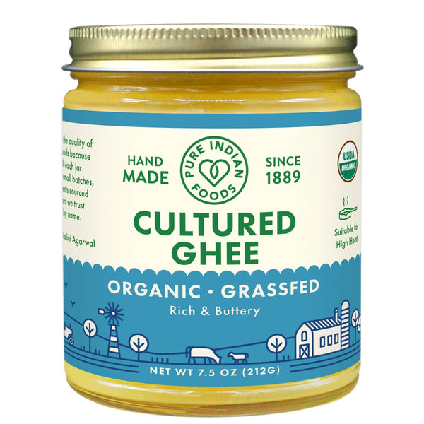 Close-up of organic cultured ghee texture showing rich golden colour inside the jar