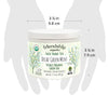 Close-up of Friendship Organics Decaf Green Mint Tea packaging showing Fair Trade and Organic certifications