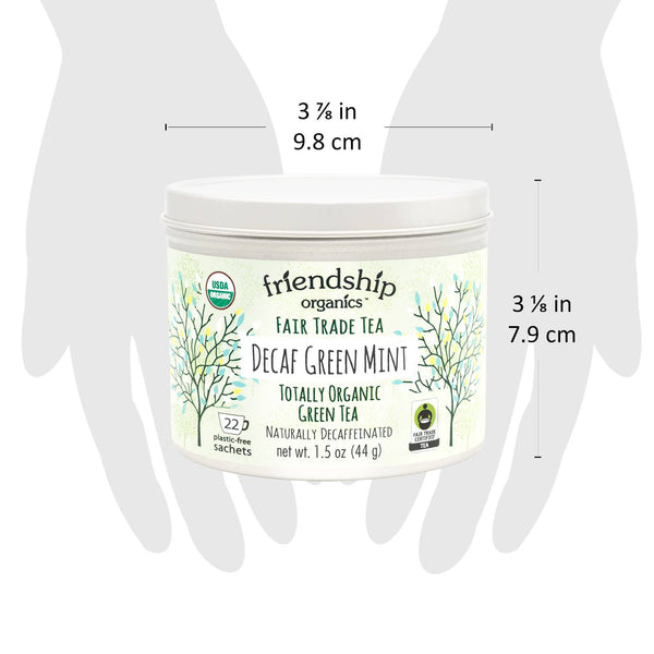Close-up of Friendship Organics Decaf Green Mint Tea packaging showing Fair Trade and Organic certifications
