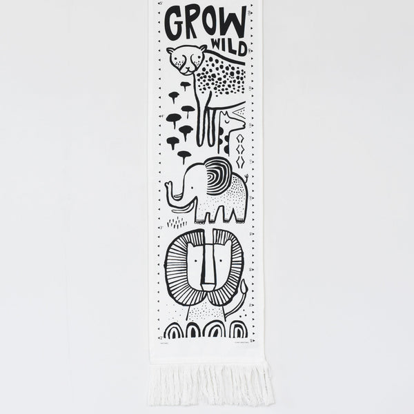Decorative banner with black line art of animals and 'Grow Wild' text on a white background