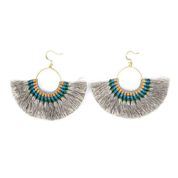 Pair of fringe earrings with colorful beads on a white background