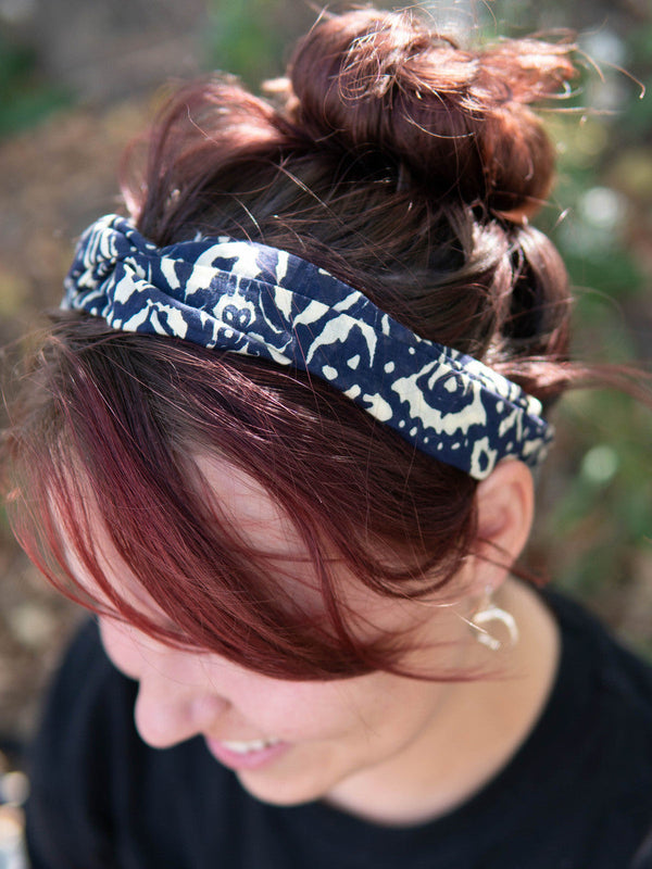 Woman wearing fair trade blue elastic knot headband by Fair Anita