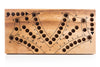 Wooden cribbage board with pegs on a white background
