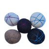 Five felted wool balls with yarn patterns on a white background