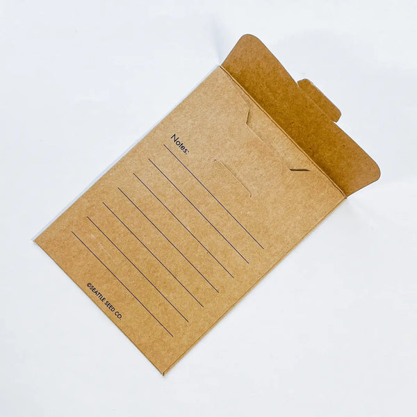Seed saving envelopes laid flat showing the notes section on the back for observations or a personal gift message