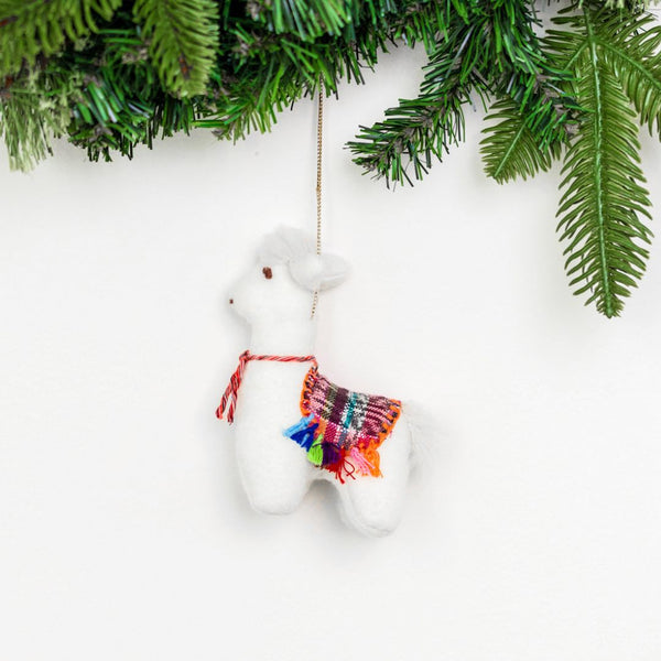 Add a touch of whimsy to your home with our adorable Felt Llama Ornament. Made from sustainable materials and featuring vibrant colors, this ornament is perfect for children and adults alike. Order yours today!