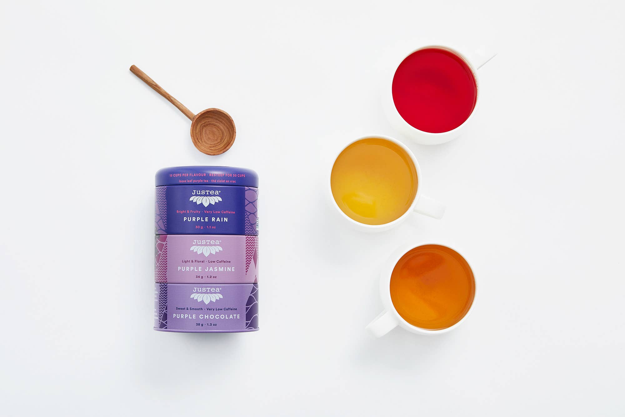 Purple Rain chocolate packaging with three cups of different colored liquids on a white background