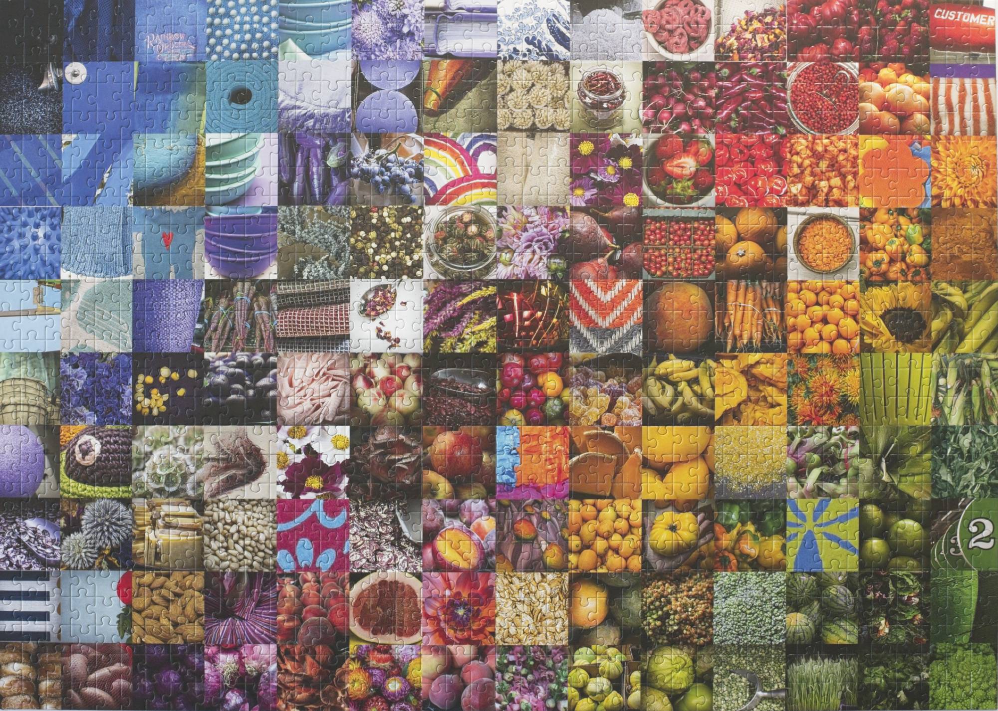 Completed 50 Years of Rainbow 1000-piece jigsaw puzzle showing a rainbow gradient collage for Rainbow Grocery Cooperative