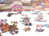 50 Years of Rainbow jigsaw puzzle partly assembled, with the rainbow collage taking shape