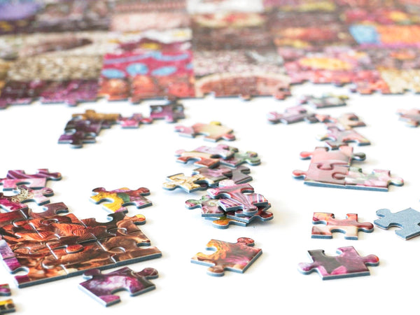50 Years of Rainbow jigsaw puzzle partly assembled, with the rainbow collage taking shape