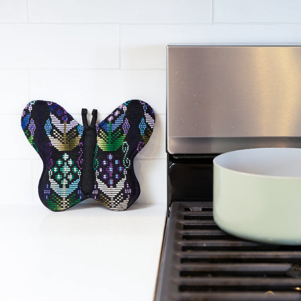 Add a touch of luxury and sustainability to your kitchen with our Brocade Butterfly Pot Holder. Made from upcycled brocade fabric and supporting fair trade practices, this unique pot holder is both stylish and functional. Order yours today!