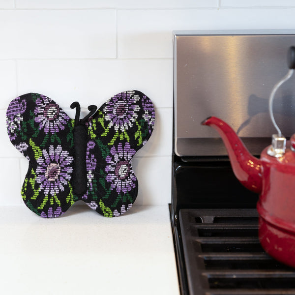 Add a touch of luxury and sustainability to your kitchen with our Brocade Butterfly Pot Holder. Made from upcycled brocade fabric and supporting fair trade practices, this unique pot holder is both stylish and functional. Order yours today!