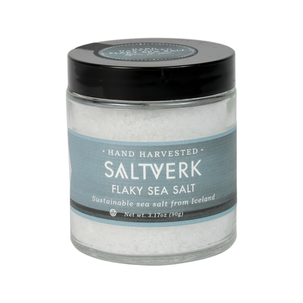 Jar of Saltverk flaky sea salt on a white background