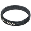 Black woven palm flower bracelet with bold floral pattern handcrafted by indigenous Colombian artisans