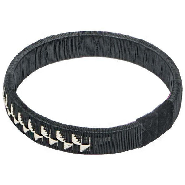 Black woven palm flower bracelet with bold floral pattern handcrafted by indigenous Colombian artisans