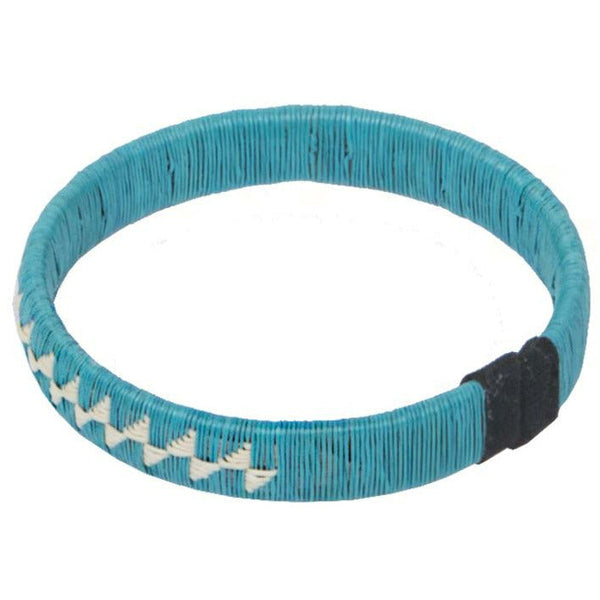 Blue woven palm flower bracelet handmade from natural palm thread by Wounaan artisans in Colombia