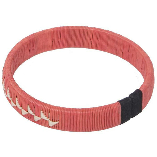 Coral woven palm flower bracelet handcrafted by indigenous Wounaan weavers with sterling silver detail