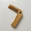 Foldable Bamboo Hair Comb, a travel-friendly sustainable hair care essential