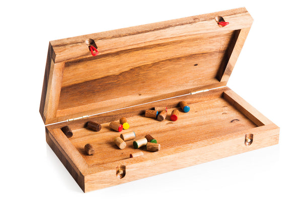 Wooden box with fishing lures on a white background
