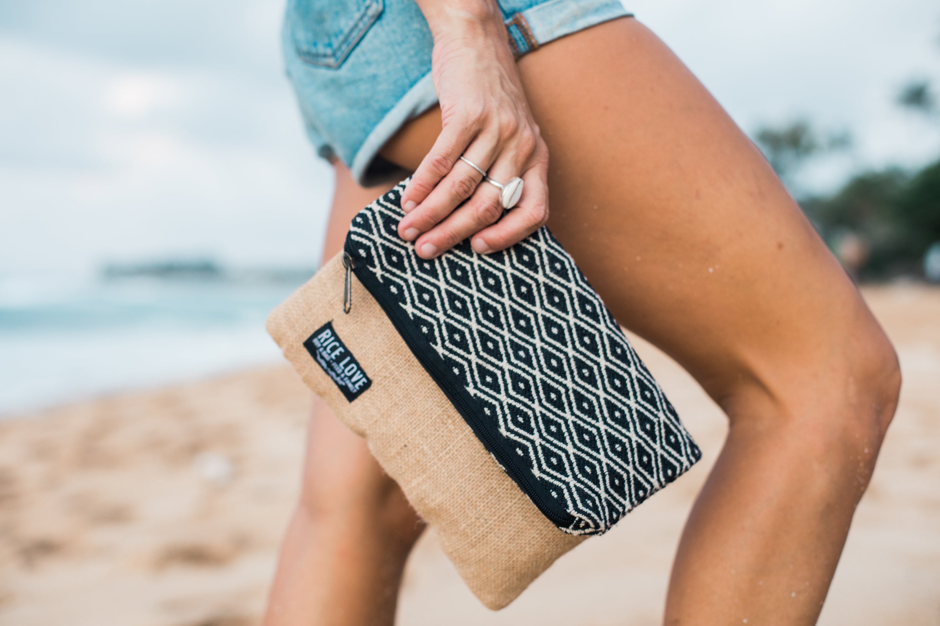 Close-up of the Foldover Clutch - Sara showing handwoven fabric and jute texture
