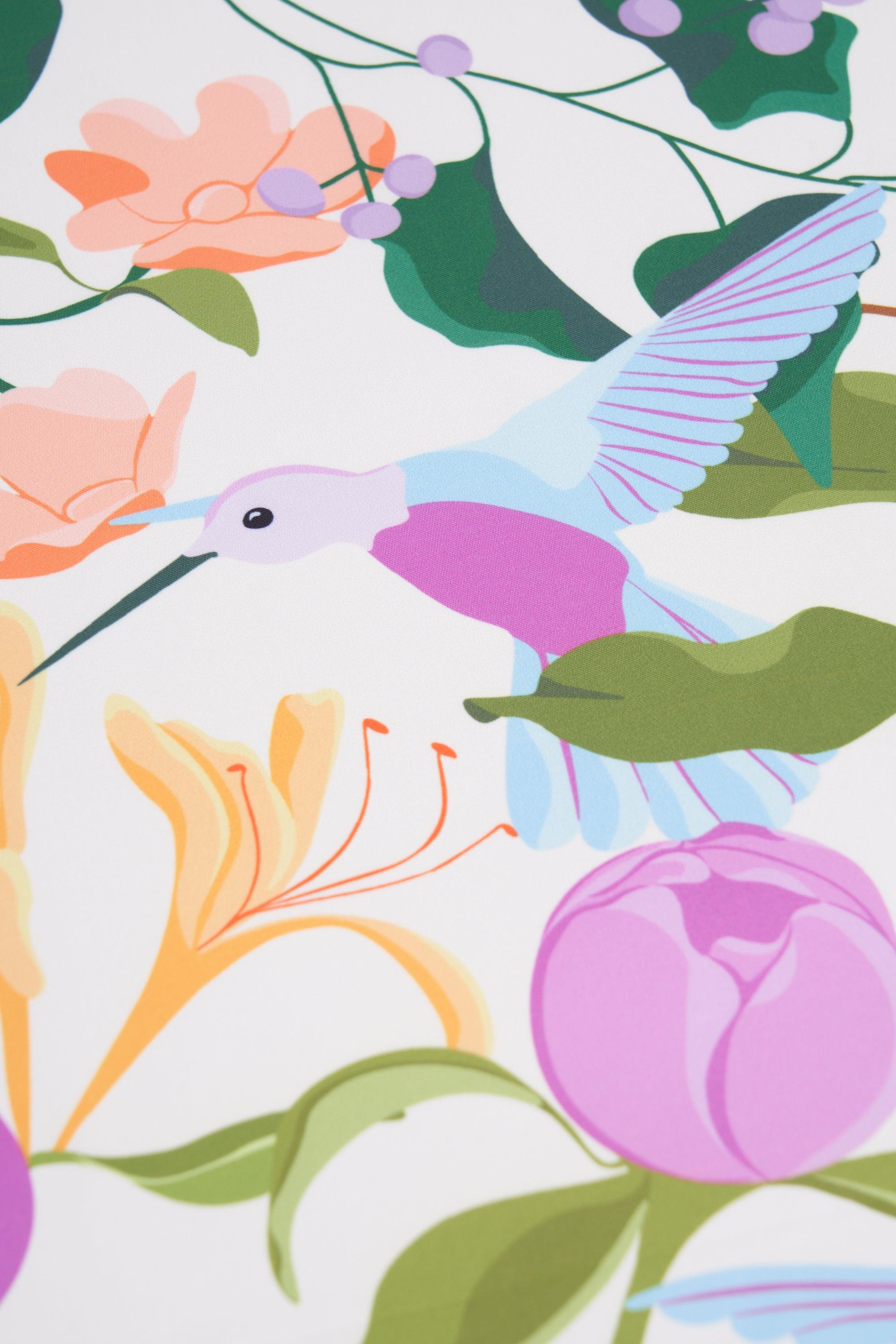 Colorful illustration of a hummingbird and flowers on a white background