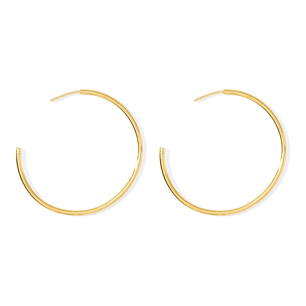 Gold hoop earrings on a white background