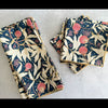Gooseberry cotton cloth napkins folded on a table — navy blue botanical print by Dot and Army