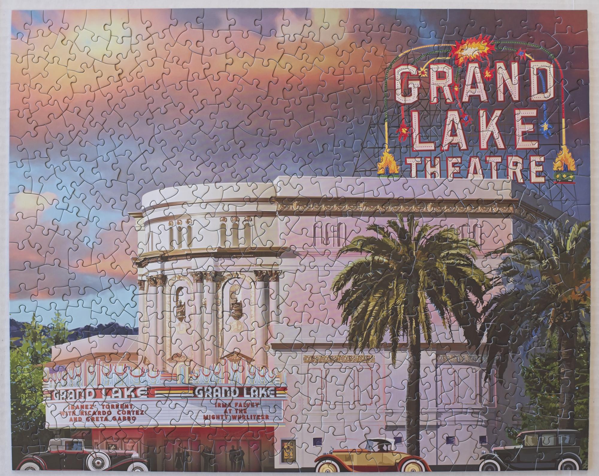Completed Grand Lake Theatre 500-piece jigsaw puzzle by Larry Hausen showing the Oakland theater