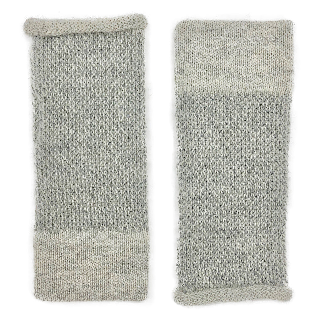 Pair of gray knit arm warmers on a white background