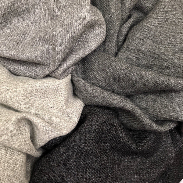 Indulge in the ultimate luxury with our Charcoal Handloom Cashmere Scarf. Crafted from sustainable cashmere, this scarf is incredibly soft, warm, and stylish. Perfect for any occasion, our scarf is a must-have for the eco-conscious fashionista. Shop now and experience the difference!