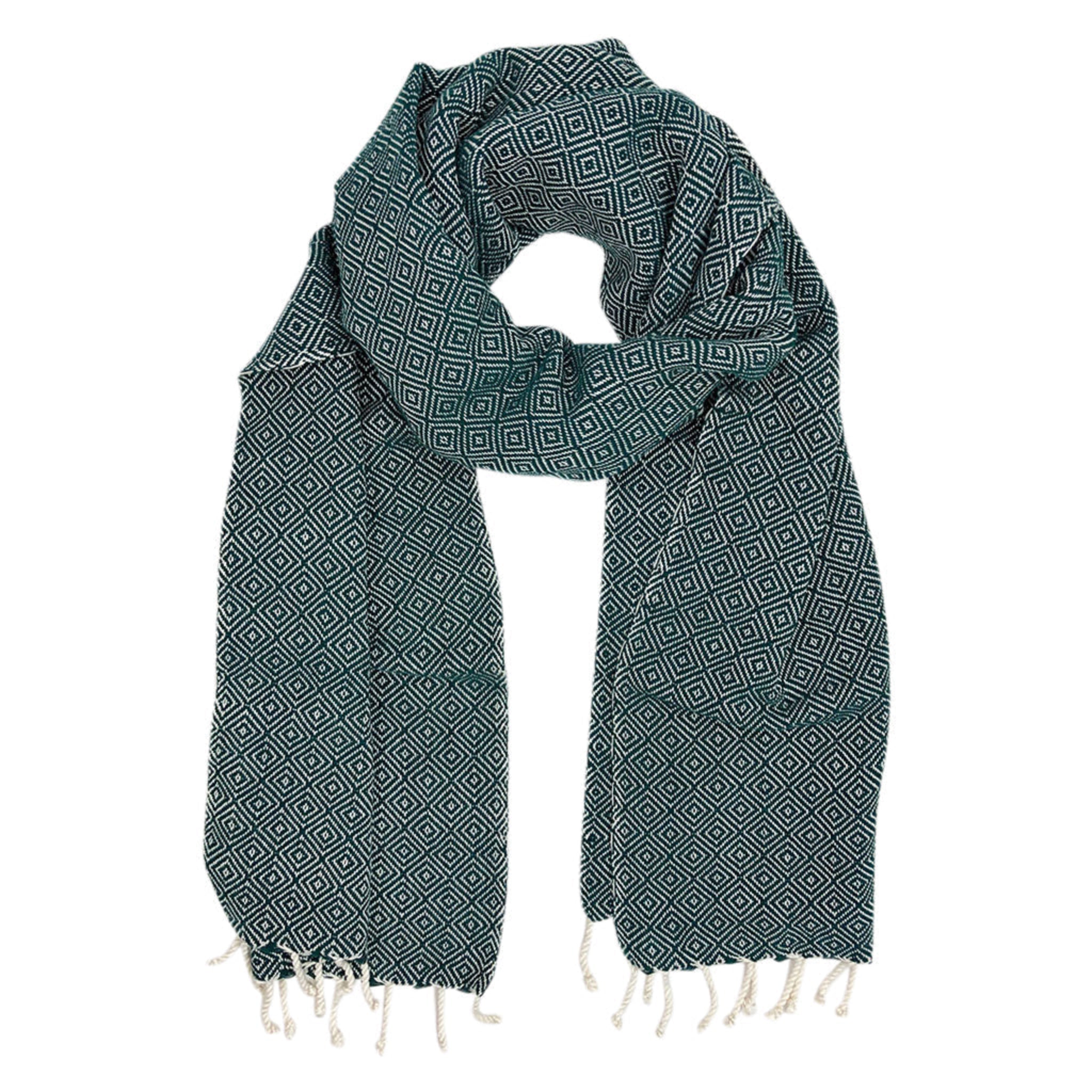 Green patterned scarf with white fringe on a white background