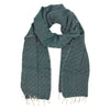 Green patterned scarf with white fringe on a white background