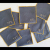Set of eight grey linen sweary cocktail coasters with deep yellow edging by Dot and Army