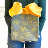 EverBag grey floral reusable gift bag laying flat showing compact storage design