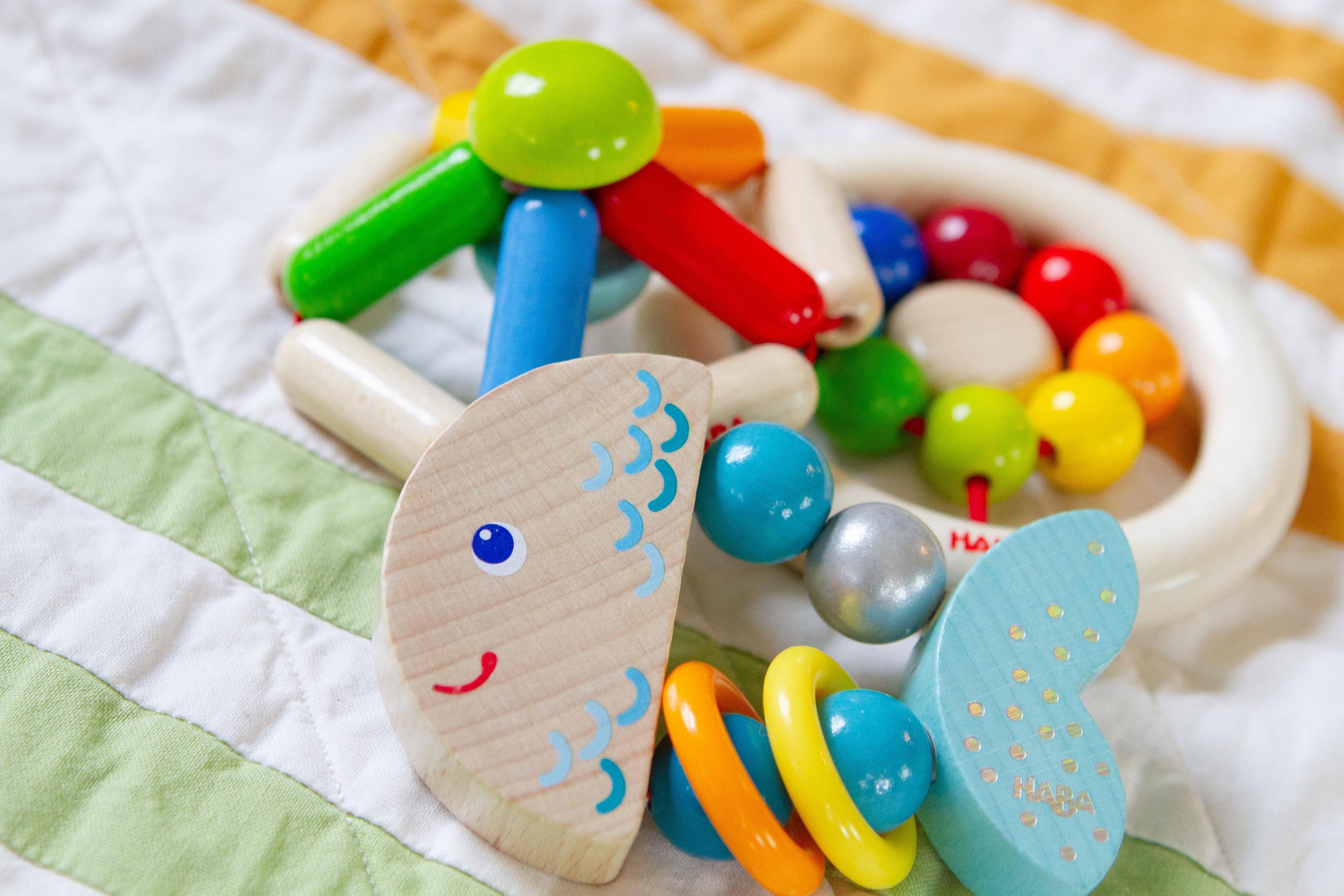 HABA Rattlefish Wooden Baby Rattle displayed as a sustainable baby shower gift option
