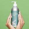 Plaine Products Hair and Body Wash lifestyle shot with sage green styling