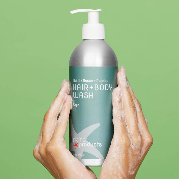 Plaine Products Hair and Body Wash lifestyle shot with sage green styling