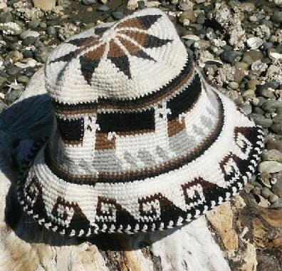 Decorative hat with geometric patterns on a stone surface