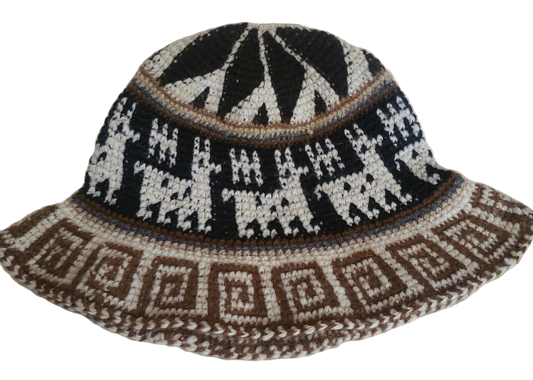 Bucket hat with black, white, and brown geometric pattern on a light background