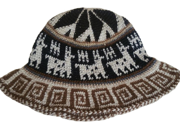 Bucket hat with black, white, and brown geometric pattern on a light background