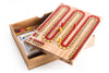 Wooden cribbage board with pegs and cards on a white background