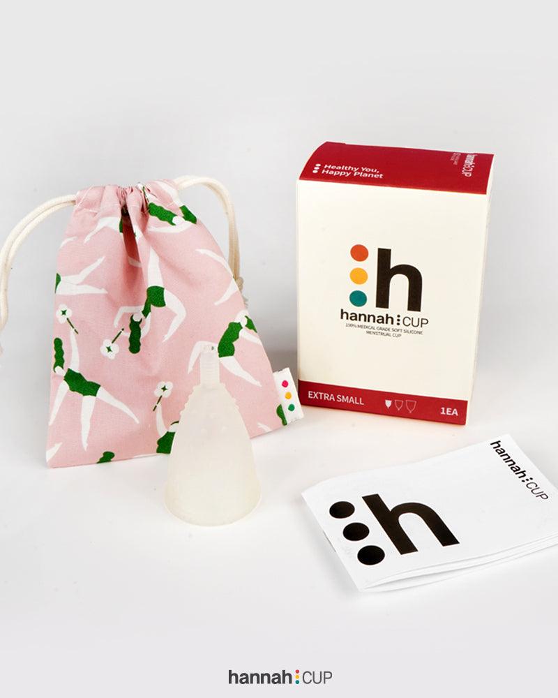 hannahCUP XS menstrual cup shown with carry pouch and instructions included in the set
