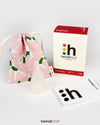 hannahCUP XS menstrual cup shown with carry pouch and instructions included in the set