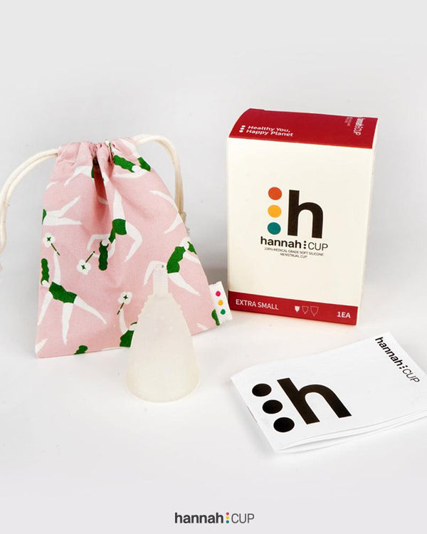 hannahCUP XS menstrual cup shown with carry pouch and instructions included in the set