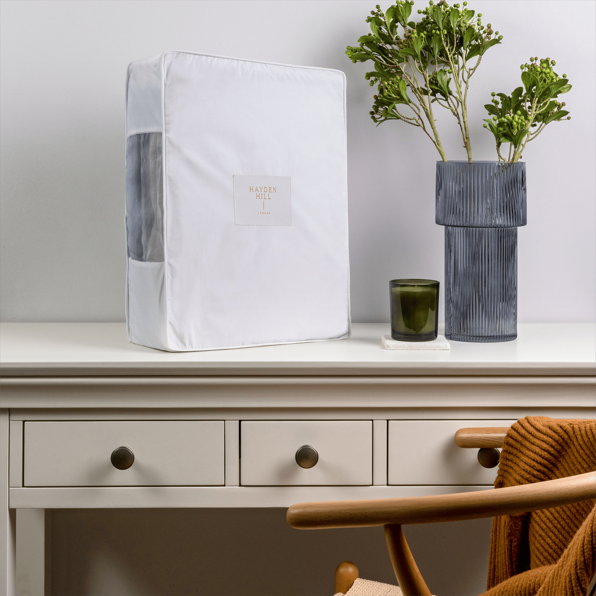 Extra large organic cotton storage bag displayed on a dresser in a tidy bedroom