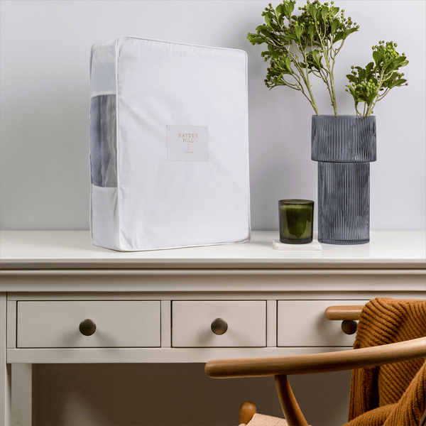 Extra large organic cotton storage bag displayed on a dresser in a tidy bedroom