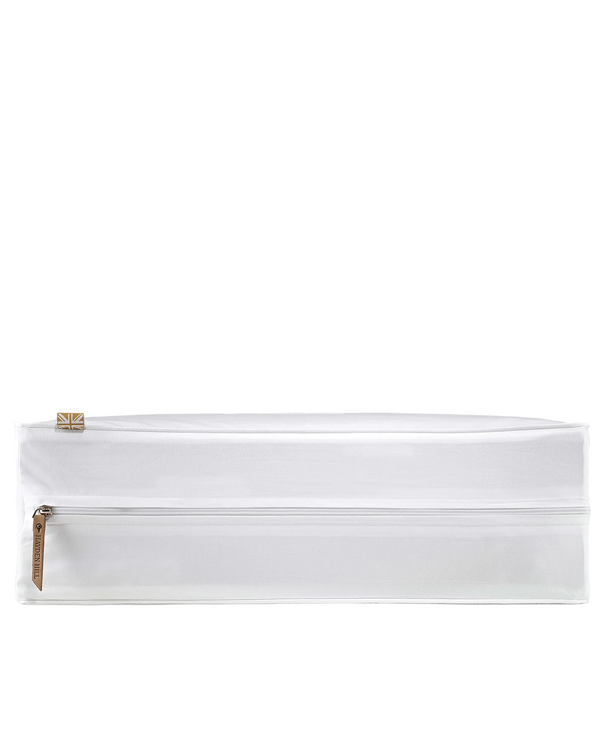 White pouch with gold zipper on a gray background