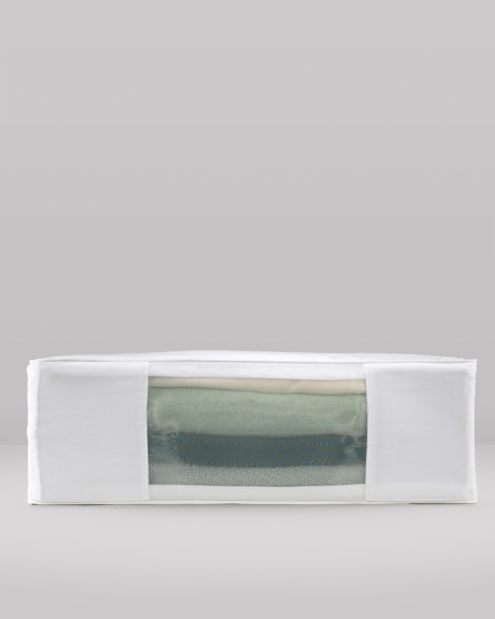 Side profile view of Hayden Hill double extra large organic cotton storage bag filled with clothes