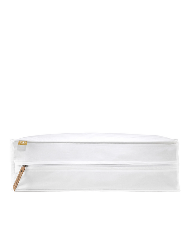 White pouch with a wooden stick on a gray background
